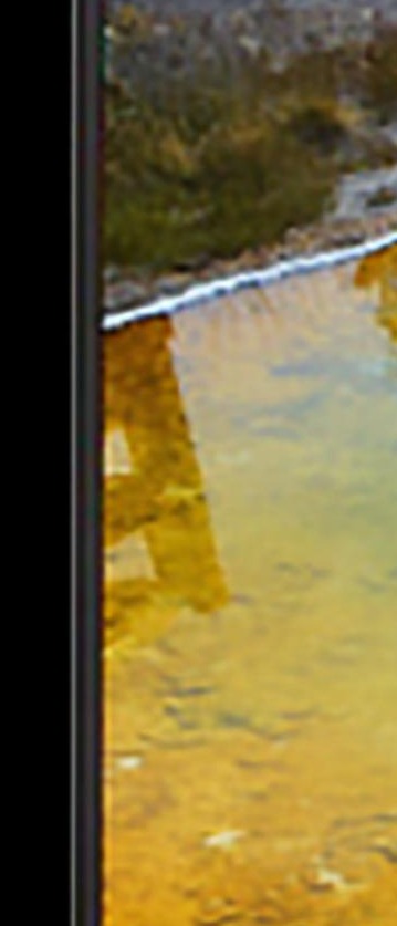 LED poster screen displaying a warm scenic landscape in high resolution