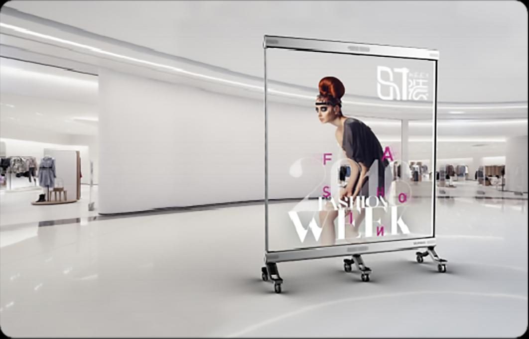 Free-standing transparent LED panel playing bright content while the room behind stays clearly visible through it